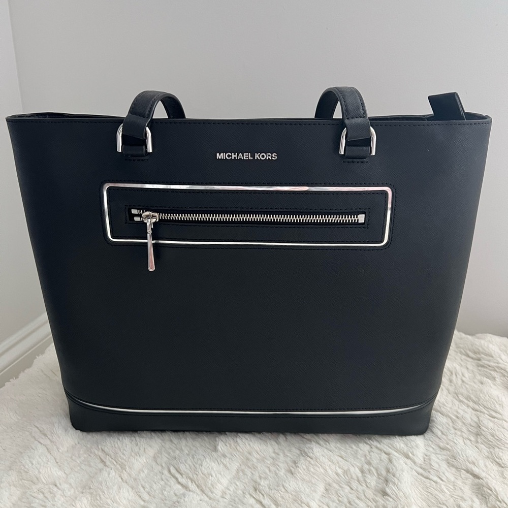 Like new black Michael Kors tote.  Size is 15”L x 11” H x 4.5”W